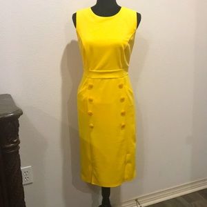 Beautiful full lined yellow dress with pockets..